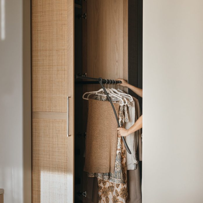 Floor to ceiling solid timber cupboard doors with rattan as a walk in robe | Loughlin Furniture