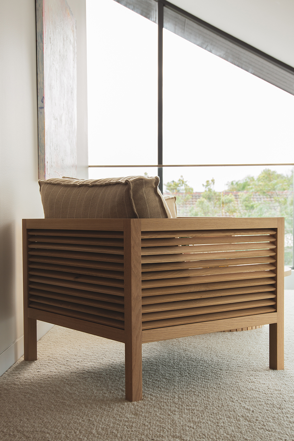 Timber lounge chair in the Loughlin Furniture Showroom